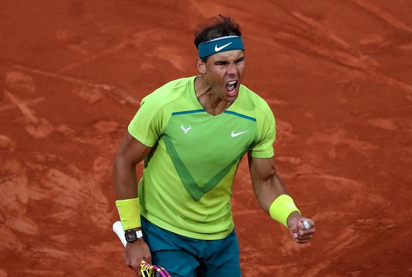 epa09985181 Rafael Nadal of Spain reacts as he plays Felix Auger-Aliassime of Canada in their men?s fourth round match during the French Open tennis tournament at Roland ?Garros in Paris, France, 29 M ...