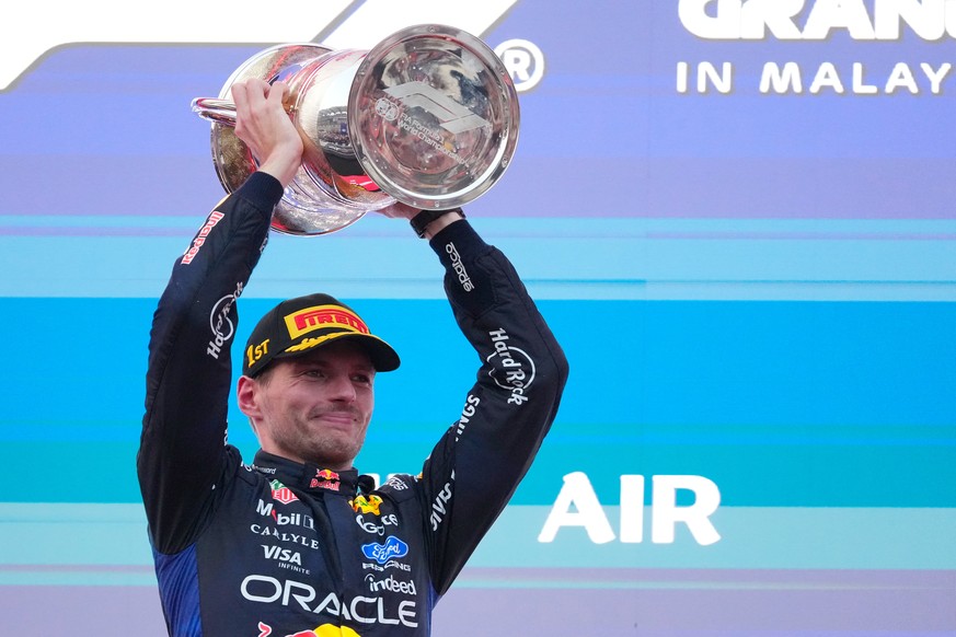 Red Bull driver Max Verstappen of the Netherlands celebrates with his trophy on the podium after winning the Bahrain Grand Prix in Sepang, Malaysia, Sunday, Oct. 4, 2026. (AP Photo/Vincent Thian)
Bahr ...