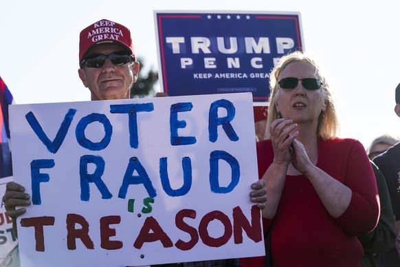 Supporters of President Donald Trump react at a rally after it was announced that President-elect Joe Biden defeated President Trump Saturday, Nov. 7, 2020, in Milwaukee. Biden defeated President Dona ...