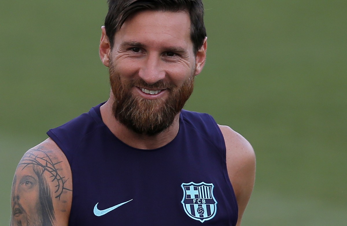 FC Barcelona's Lionel Messi smiles during a training session at the Sports Center FC Barcelona Joan Gamper in Sant Joan Despi, Tuesday, Aug. 7, 2018. (AP Photo/Manu Fernandez)