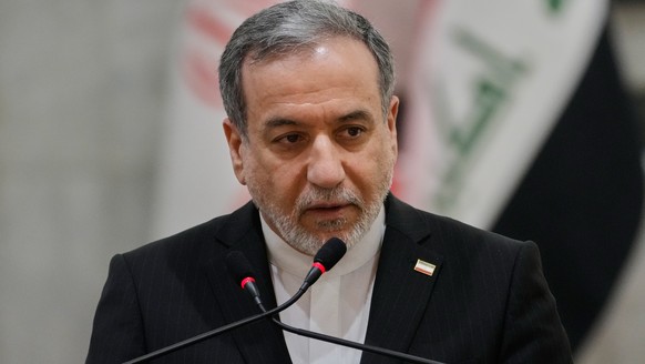 Iranian Foreign Minister Abbas Araghchi speaks during a news conference with his Iraqi counterpart Fouad Hussein after their meeting at the foreign ministry in Baghdad, Iraq, Sunday, June 28, 2026. (A ...