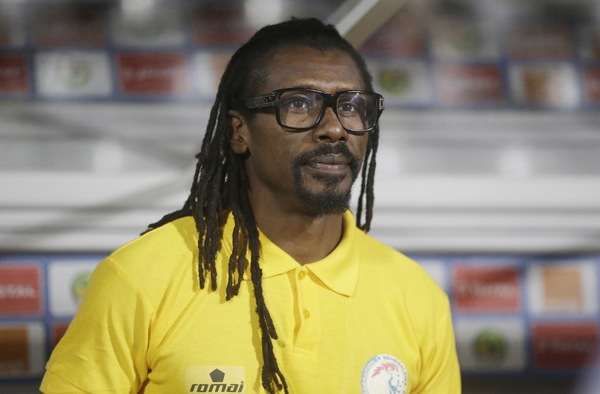 FILE - In this Thursday Jan. 19, 2017 filer, Senegal Soccer Coach, Aliou Cisse, is pictured before their African Cup of Nations Group B soccer match between Senegal and Zimbabwe at, Stade de Francevil ...