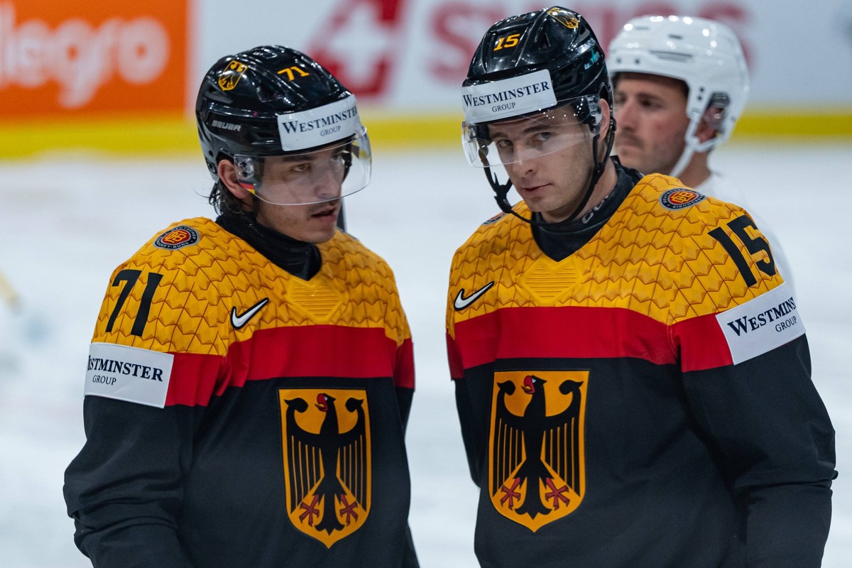 ZURICH, SWITZERLAND - MAY 17: Daniel Fischbuch Germany, 71 and Stefan Loibl Germany, 15 during the Preliminary Round - Group A Match 15 between Germany and Latvia at the IIHF Ice hockey, Eishockey Wor ...