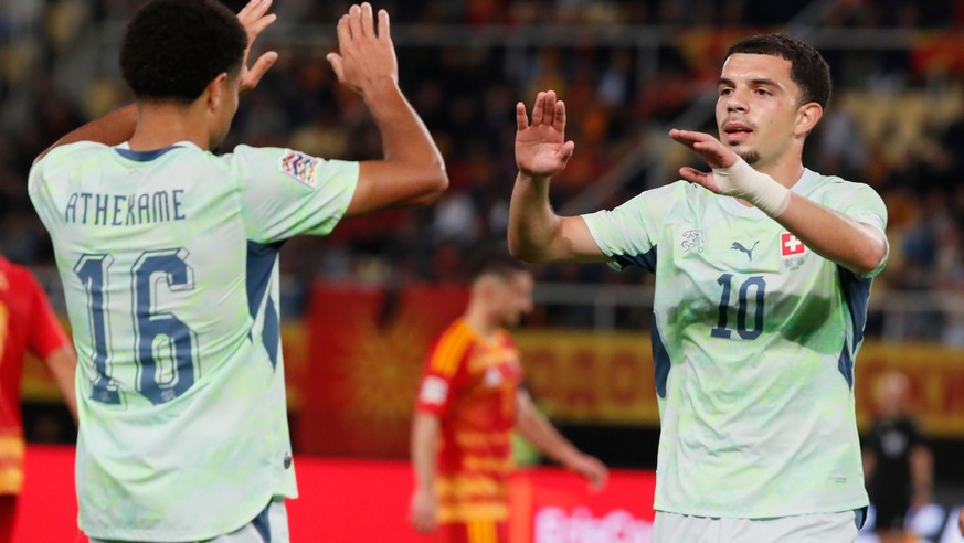 Switzerland's Zachary Athekame, left, and Switzerland's Zeki Amdouni celebrate second goal during the UEFA Nations League soccer match between North Macedonia and Switzerland in Skopje, Nort ...
