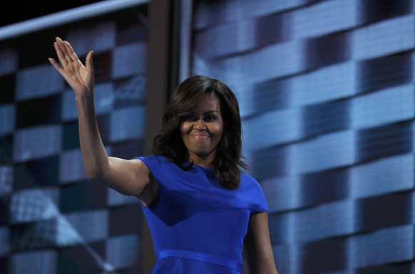 U.S. first lady Michelle Obama waves after speaking during the first session at the Democratic National Convention in Philadelphia, Pennsylvania, U.S., July 25, 2016. REUTERS/Jim Young