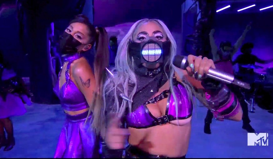 In this video grab issued Sunday, Aug. 30, 2020, by MTV, Ariana Grande, left, and Lady Gaga perform &quot;Rain On Me&quot; during the MTV Video Music Awards. (MTV via AP)