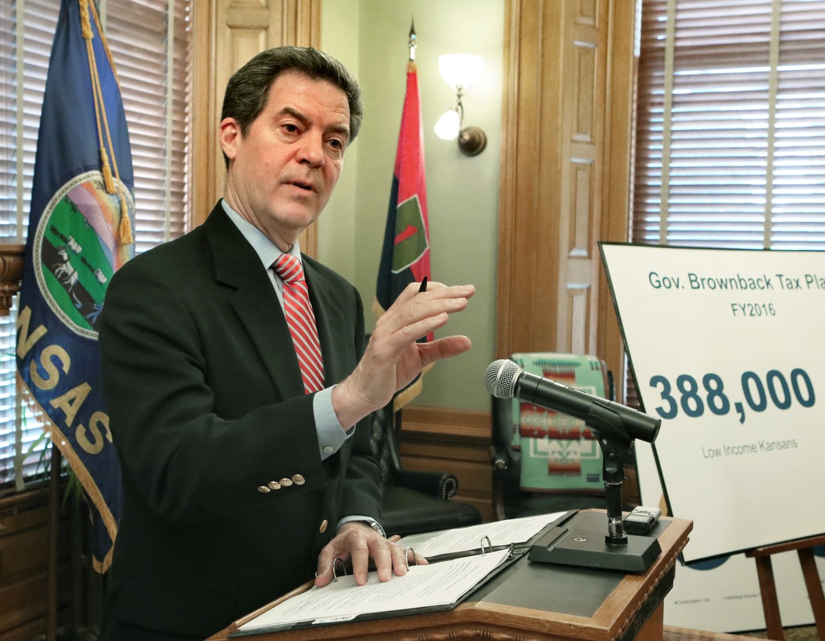 Gov. Sam Brownback meets with the media on Saturday, May 30, 2015 in Topeka, Kan. Brownback is proposing a state sales tax increase and other measures to deal with the state's projected budget sh ...