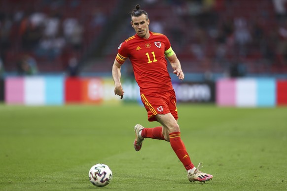 FILE - Wales&#039; Gareth Bale runs with the ball during the Euro 2020 soccer championship round of 16 match between Wales and Denmark at the Johan Cruyff ArenA in Amsterdam, Netherlands, on June 26,  ...