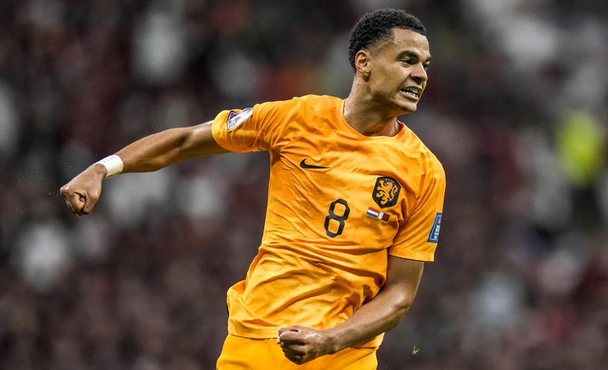 Cody Gakpo of the Netherlands celebrates after scoring his side&#039;s opening goal during the World Cup group A soccer match between the Netherlands and Qatar, at the Al Bayt Stadium in Al Khor , Qat ...