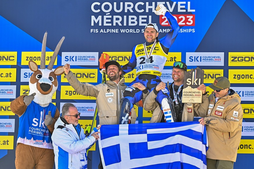 Silver medalist AJ Ginnis of Greece is celebrated by her team during the medals ceremony of the men&#039;s slalom race at the 2023 FIS Alpine Skiing World Championships in Courchevel/Meribel, France,  ...