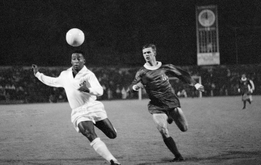 Pele (left) from the Santos FC and Pirmin Stierli of the FC Zuerich fight for the ball in a friendly match at the Letzigrund stadium in Zurich, Switzerland, on June 15th, 1968. 16000 people watched th ...