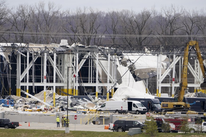 A heavily damaged Amazon fulfillment center is seen Saturday, Dec. 11, 2021, in Edwardsville, Ill. A large section of the roof of the building was ripped off and walls collapsed when strong storms mov ...