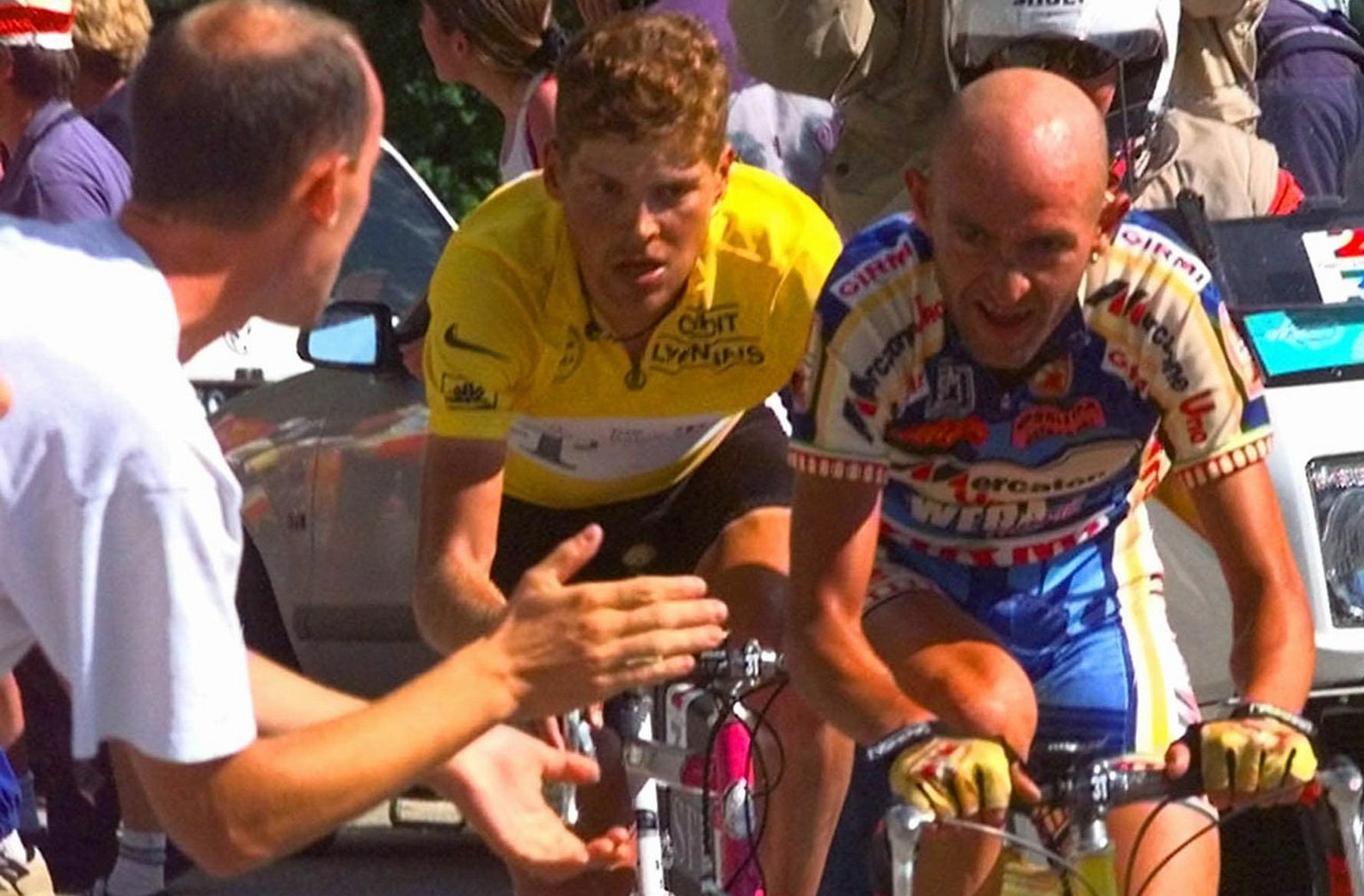 Marco Pantani of Italy, right, climbs ahead of overall leader Jan Ullrich of Germany on his way to win the 13th stage of the Tour de France cycling race between Saint-Etienne, central France, and l&#0 ...