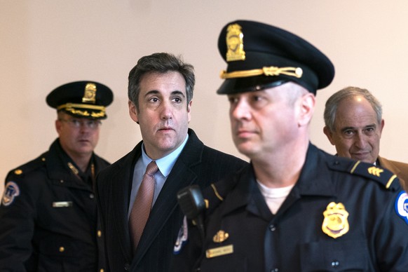 epaselect epa07417410 Michael Cohen (C-L), former attorney to US President Donald J. Trump, arrives to testify before the House Oversight Committee in the US Capitol in Washington, DC, USA, 06 March 2 ...