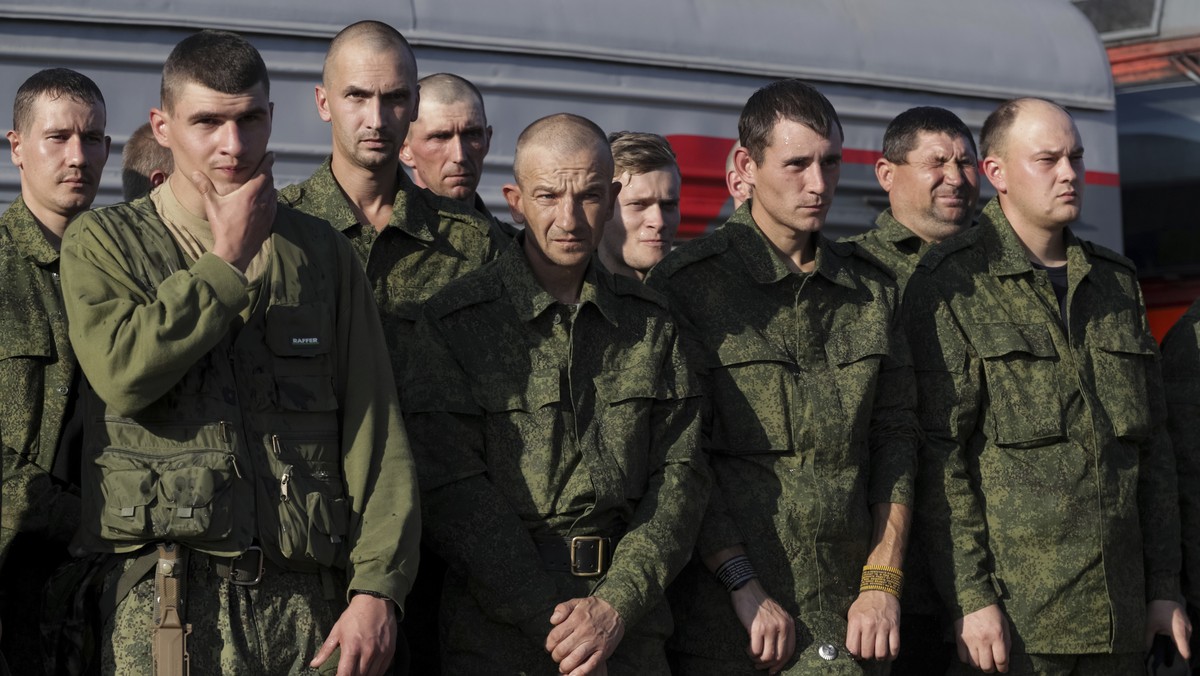 Russian recruits stand waiting to take a train at a railway station in Prudboi, Volgograd region of Russia, Thursday, Sept. 29, 2022. Russian President Vladimir Putin has ordered a partial mobilizatio ...