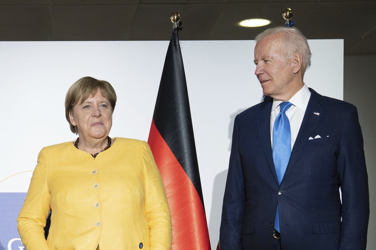 From left, British Prime Minister Boris Johnson, French President Emmanuel Macron, German Chancellor Angela Merkel and U.S. President Joe Biden at the G20 summit in Rome, Saturday, Oct. 30, 2021. The  ...