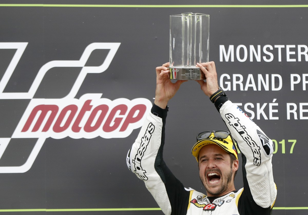 Switzerland's Moto2 rider Thomas Luthi of the CarXpert Interwetten celebrates his victory in the Moto2 race at the Czech Republic motorcycle Grand Prix at the Automotodrom Brno, in Brno, Czech Re ...