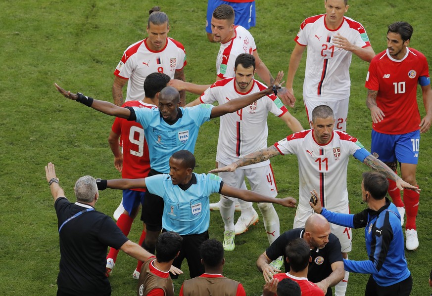 Referees pull apart Costa Rica&#039;s and Serbia&#039;s players as they argue during the group E match between Costa Rica and Serbia at the 2018 soccer World Cup in the Samara Arena in Samara, Russia, ...