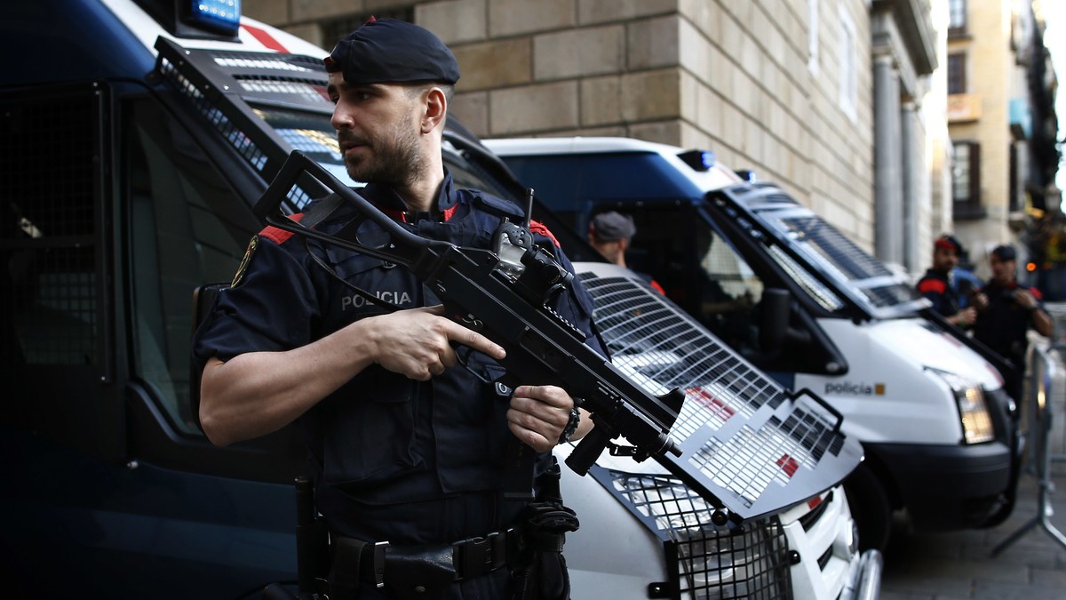 Catalan police officers stand guard next to the Palau Generalitat in Barcelona, Spain, Monday Oct. 30, 2017. Catalonia's civil servants face their first full work week since Spain's central  ...