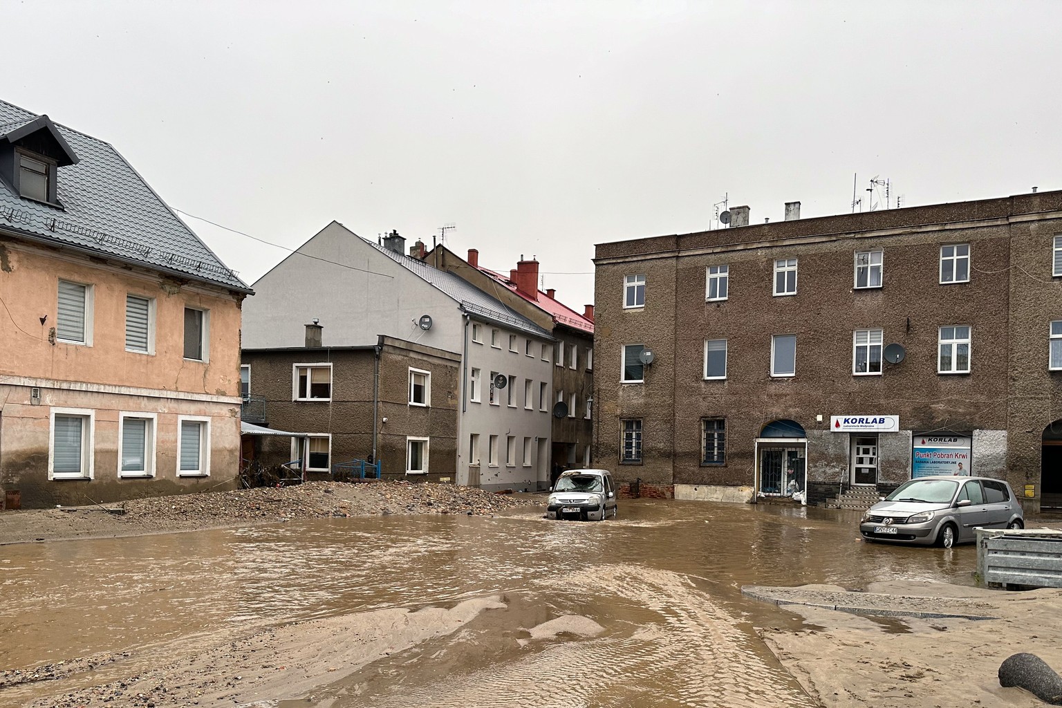 epa11606607 Damages on flooded streets after heavy rainfalls in Glucholazy, southwestern Poland, 15 September 2024. The southern regions of Poland are experiencing record rainfall and severe flooding  ...