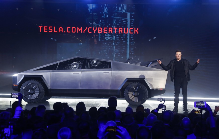 Tesla CEO Elon Musk introduces the Cybertruck at Tesla&#039;s design studio Thursday, Nov. 21, 2019, in Hawthorne, Calif. Musk is taking on the workhorse heavy pickup truck market with his latest elec ...