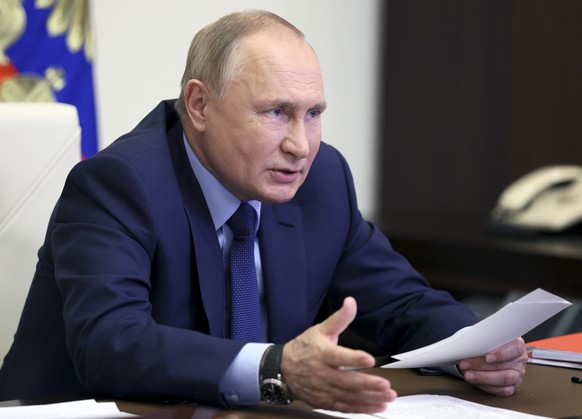 Russian President Vladimir Putin leads a meeting with officials via videoconference at the Novo-Ogaryovo residence outside Moscow, Russia, Wednesday, Nov. 10, 2021. Putin said that the military modern ...