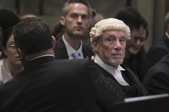 British jurist Malcolm Shaw, right, looks on during a hearing at the International Court of Justice in The Hague, Netherlands, Friday, Jan. 12, 2024. The United Nations&#039; top court opened hearings ...