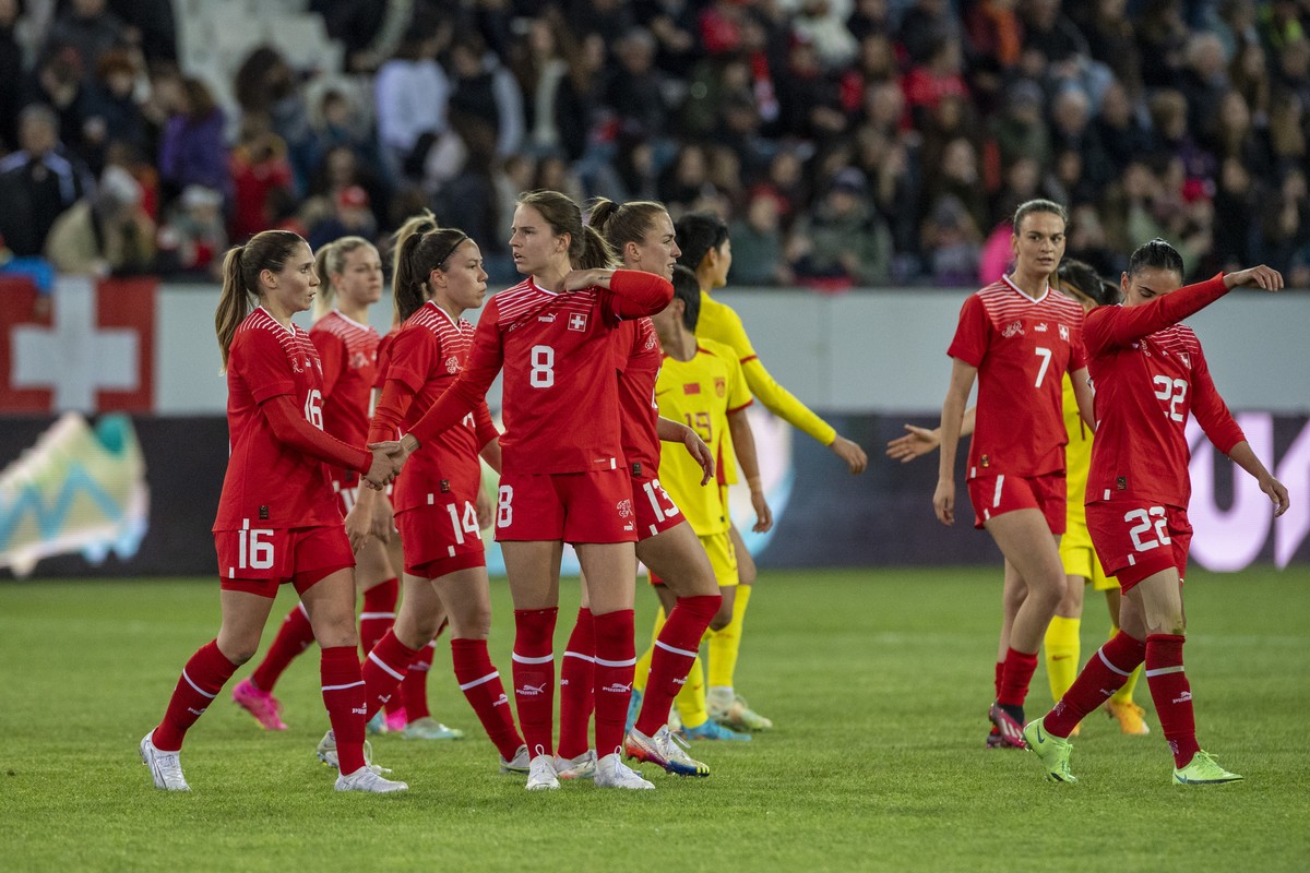 Swiss player with Naomi Megroz, centre, reacts after the game an women's international friendly soccer match between Switzerland and China at the Swissporarena in Luzern, Switzerland, on Thursday ...