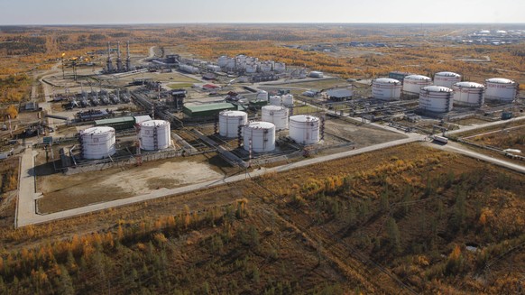 FILE- Oil storage tanks seen near the town of Usinsk, 1500 km (930 miles) northeast of Moscow, Russia, on Sept. 12, 2011. The action Thursday, April 7, 2022, by the U.S. House and Senate to revoke Mos ...