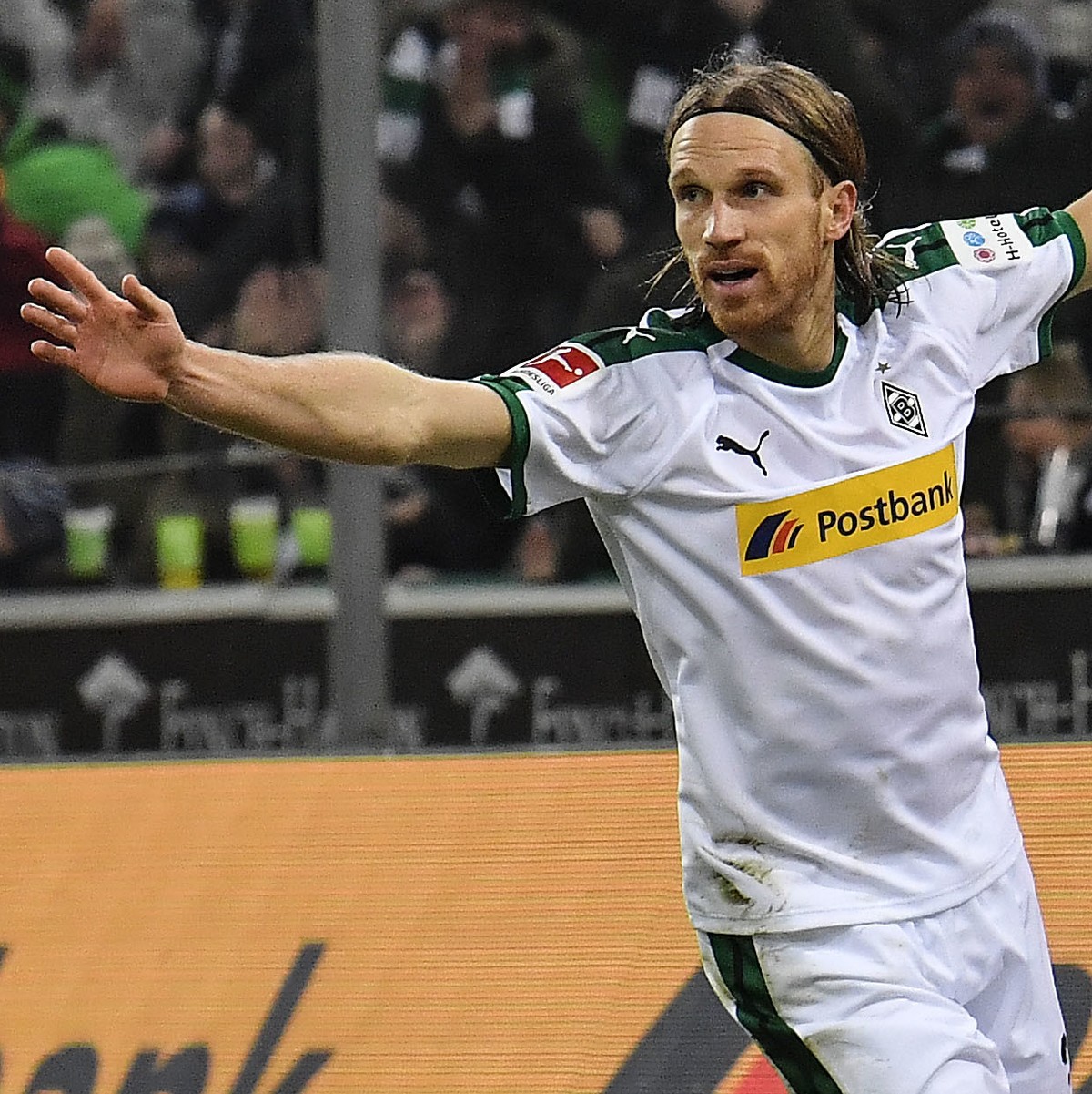 Moenchengladbach's Michael Lang celebrates after scoring his side's second goal during the German Bundesliga soccer match between Borussia Moenchengladbach and Hannover 96 at the Borussia Pa ...