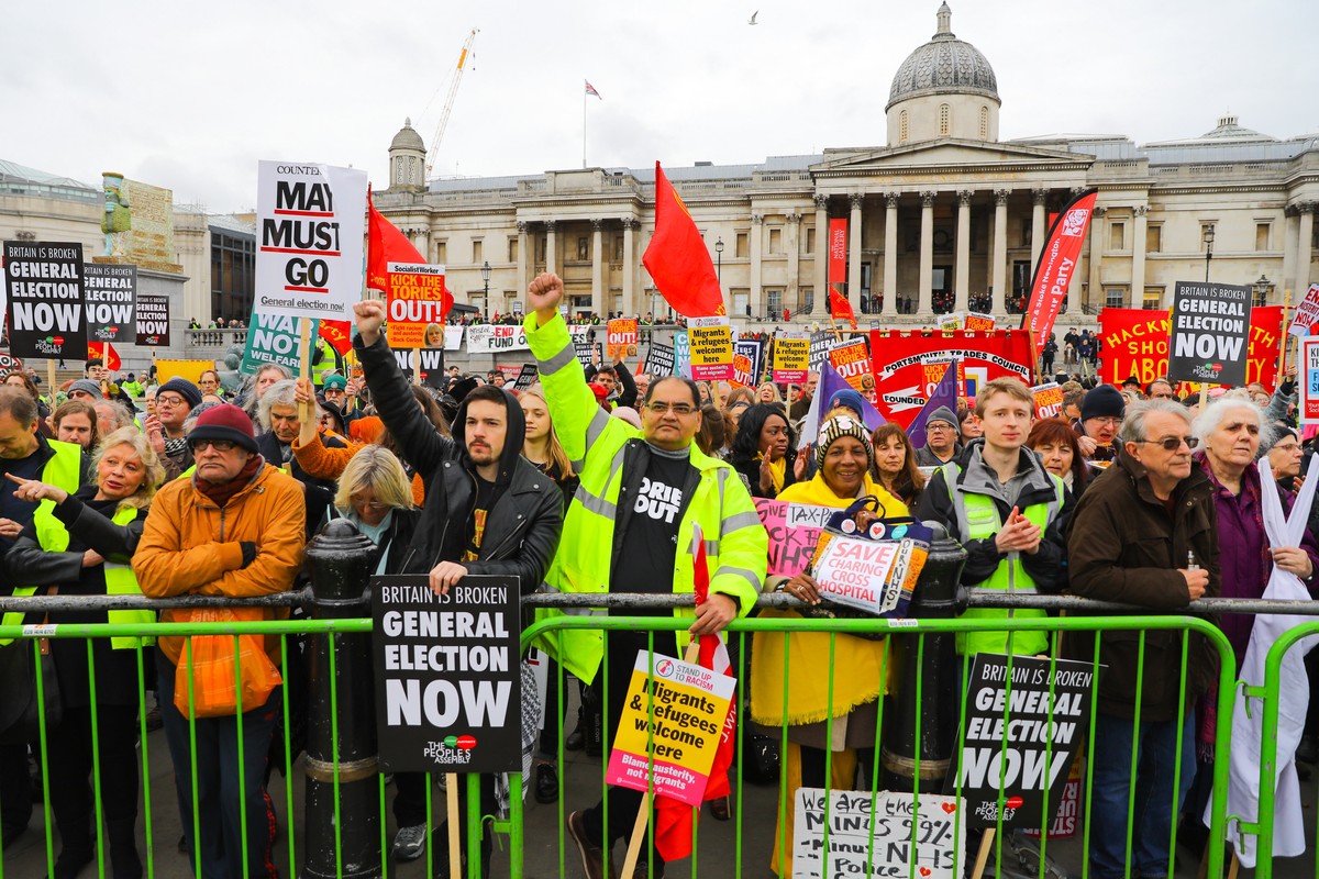 epa07277823 Demonstrators take part in the People's Assembly Against Austerity march and protest in London, Britain, 12 January 2019. Thousands of protesters, inspired by the 'Gillet Jaunes& ...