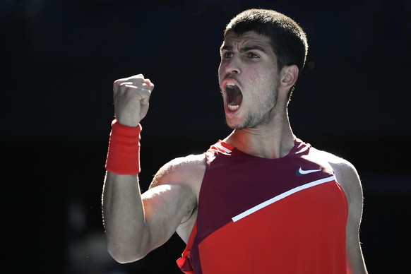 Carlos Alcaraz of Spain reacts after winning a point against Matteo Berrettini of Italy during their third round match at the Australian Open tennis championships in Melbourne, Australia, Friday, Jan. ...