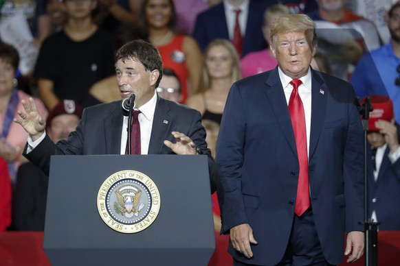 President Donald Trump, right, stands beside 12th Congressional District Republican candidate Troy Balderson, left, during a rally, Saturday, Aug. 4, 2018, in Lewis Center, Ohio. (AP Photo/John Minchi ...