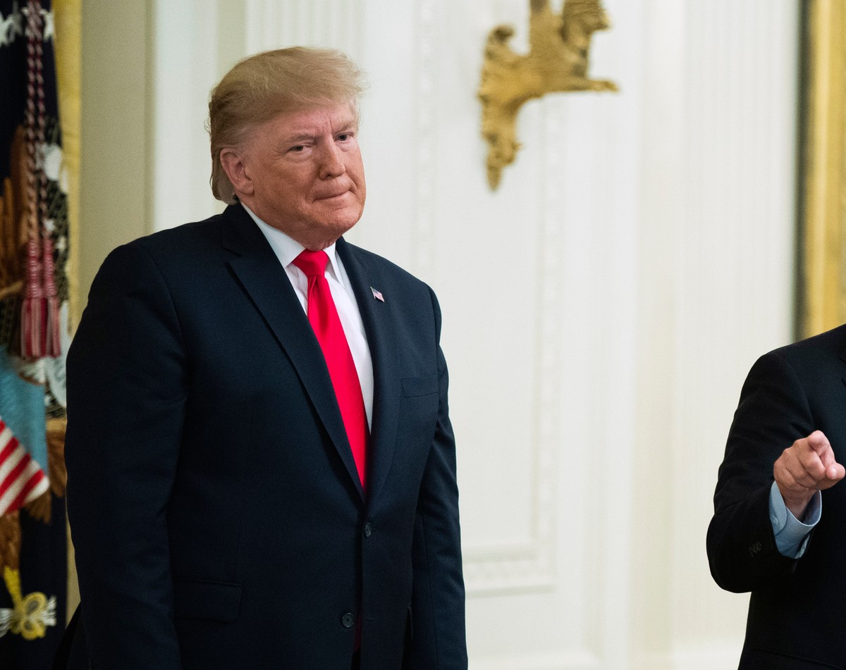FILE - President Donald Trump listens to Sen. Lindsey Graham, R-S.C., speak during a ceremony in the East Room of the White House, Nov. 6, 2019, in Washington. (AP Photo/Manuel Balce Ceneta, File)
Don ...