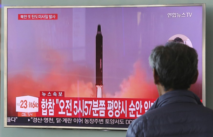 A man watches a TV screen showing a file footage of North Korea&#039;s missile launch, at the Seoul Railway Station in Seoul, South Korea, Tuesday, Aug. 29, 2017. North Korea fired a ballistic missile ...