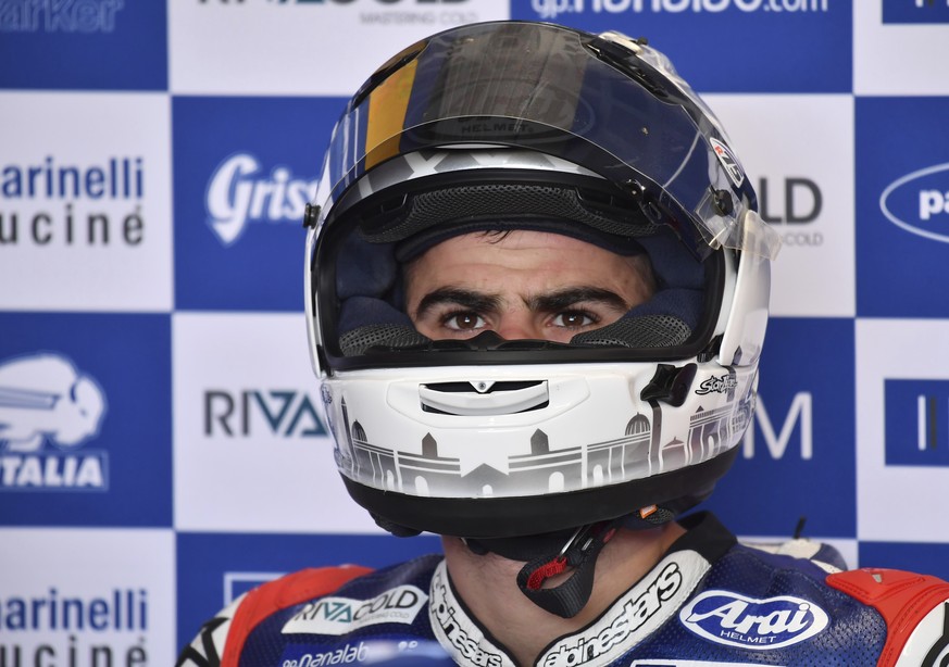 Italy&#039;s Moto3 rider Romano Fenati waits in his team garage during the second practice session for the Australian Motorcycle Grand Prix at Phillip Island near Melbourne, Australia, Friday, Oct. 20 ...