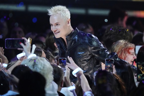 Russia&#039;s SHAMAN walks among spectators at the International Music Competition &quot;Intervision&quot; at the Live Arena outside Moscow, Russia, Sunday, Sept. 21, 2025. (AP Photo/Alexander Zemlian ...