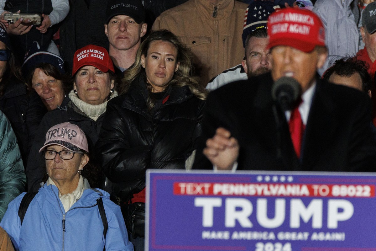 epa11277601 Women stand behind former US President Donald Trump while he speaks during a rally in Schnecksville, Pennsylvania, USA, 13 April 2024. Trump returned to the swing state of Pennsylvania day ...