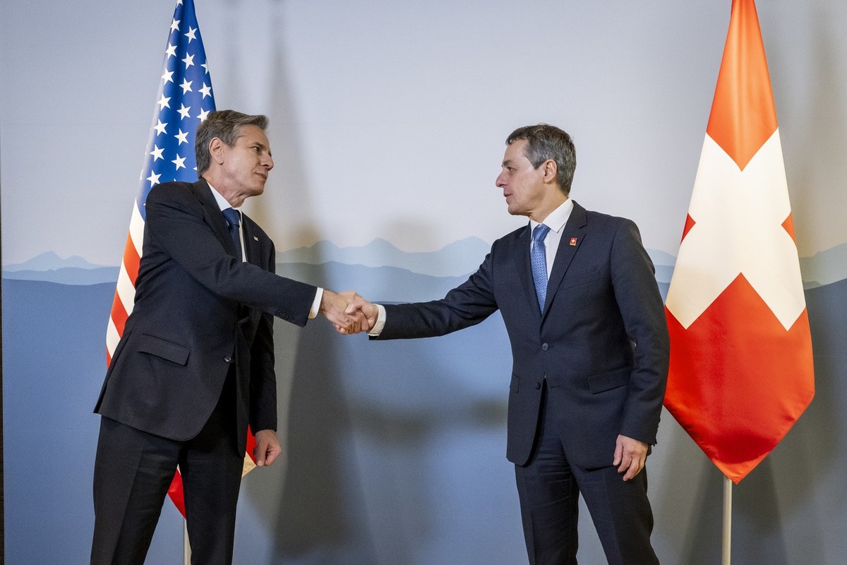 U.S. Secretary of State Antony Blinken, left, speaks to Switzerland's President and head of the Federal Department of Foreign Affairs Ignazio Cassis, right, on the sidelines of the US - Russia su ...