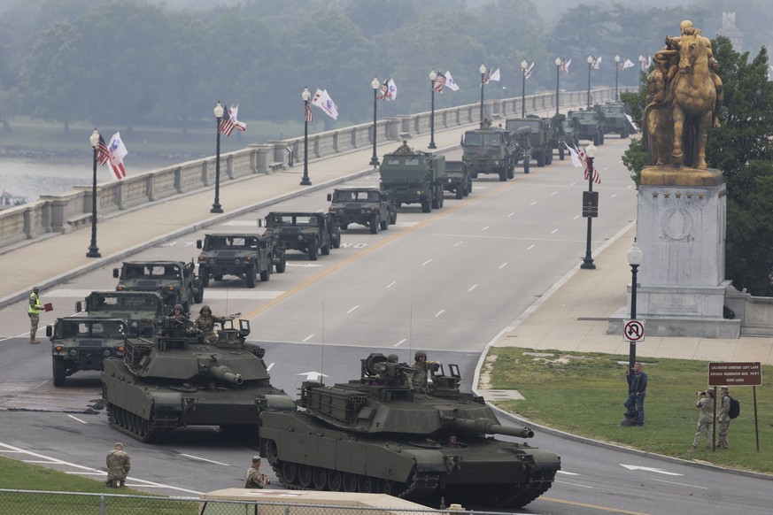 epa12176290 US military vehicles drive over the Memorial Bridge during a military parade commemorating the 250th anniversary of the United States Army in Washington, DC, USA, 14 June 2025. The parade, ...