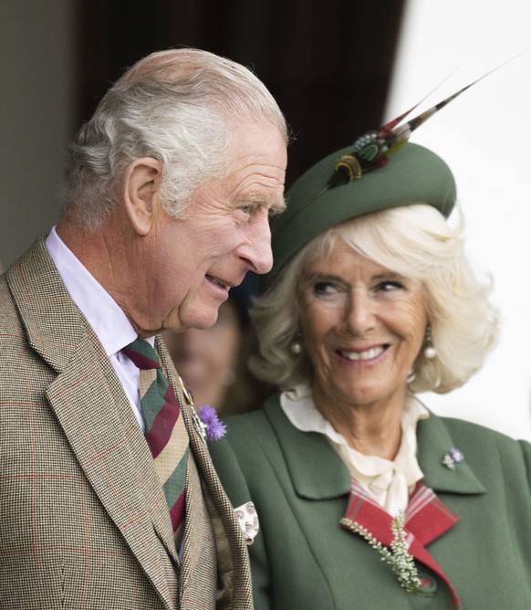 This photo provided by Buckingham Palace on Sunday, Dec. 11, 2022 has been chosen for King Charles III and the Queen Consort&#039;s 2022 Christmas card. The photograph was taken at the Braemar Games o ...