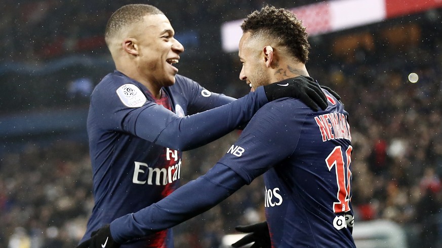 PSG&#039;s Neymar celebrates with Kylian Mbappe, left, after scoring his side&#039;s sixth goal during the League One soccer match between Paris Saint Germain and Guingamp at the Parc des Princes stad ...