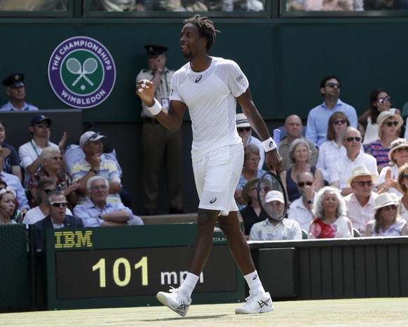 Gael Monfils of France reacts after winning a point against Britain&#039;s Kyle Edmund during their Men&#039;s Singles Match on day four at the Wimbledon Tennis Championships in London Thursday, July  ...