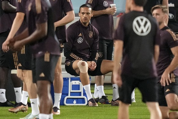 Germany's Leroy Sane waits for the start of a training session at the Al-Shamal stadium on the eve of the group E World Cup soccer match between Germany and Spain, in Al-Ruwais, Qatar, Friday, Nov. 25 ...