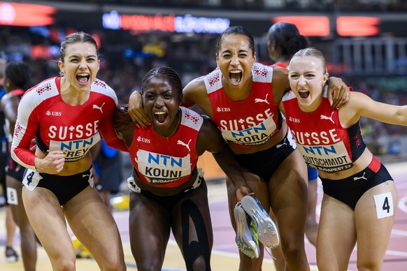 Geraldine Frey, Natacha Kouni, Salome Kora and Melissa Gutschmidt of Switzerland react during the women&#039;s 4x100 meters relay qualification of the World Athletics Championships at the National Ath ...