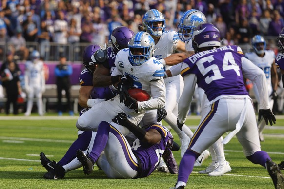 Detroit Lions linebacker Jalen Reeves-Maybin (42) is stopped by the Minnesota Vikings on a failed fake punt on fourth down during the first half of an NFL football game Sunday, Oct. 20, 2024, in Minne ...