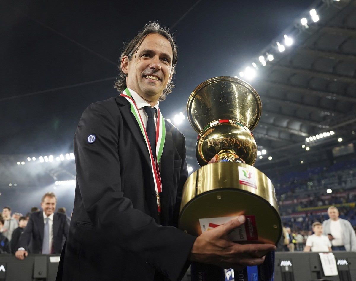 Inter Milan's coach Simone Inzaghi, celebrates after the team's victory at the Italian Cup final soccer match between Fiorentina and Inter Milan at the Rome's Olympic Stadium, Wednesday ...