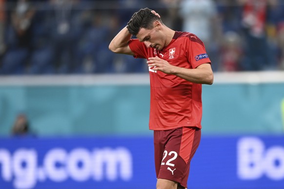 Switzerland&#039;s Fabian Schaer reacts after missing a shootout penalty during the Euro 2020 soccer championship quarterfinal match between Switzerland and Spain, at the Saint Petersburg stadium in S ...