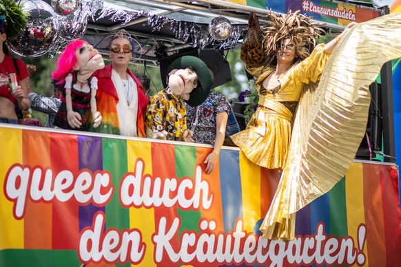 epa10696583 Participants attend the Rainbow Parade in Vienna, Austria, 17 June 2023. The Rainbow Parade, a rally against the discrimination of lesbian, gay, bisexual, transgender, intersex, queer/ques ...