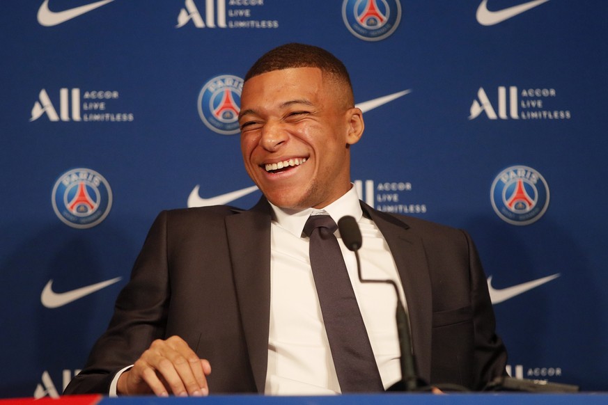 PSG striker Kylian Mbappe laughs during a press conference Monday, May 23, 2022 at the Paris des Princes stadium in Paris. Kylian Mbappé&#039;s decision to reject Real Madrid and commit to Paris Saint ...